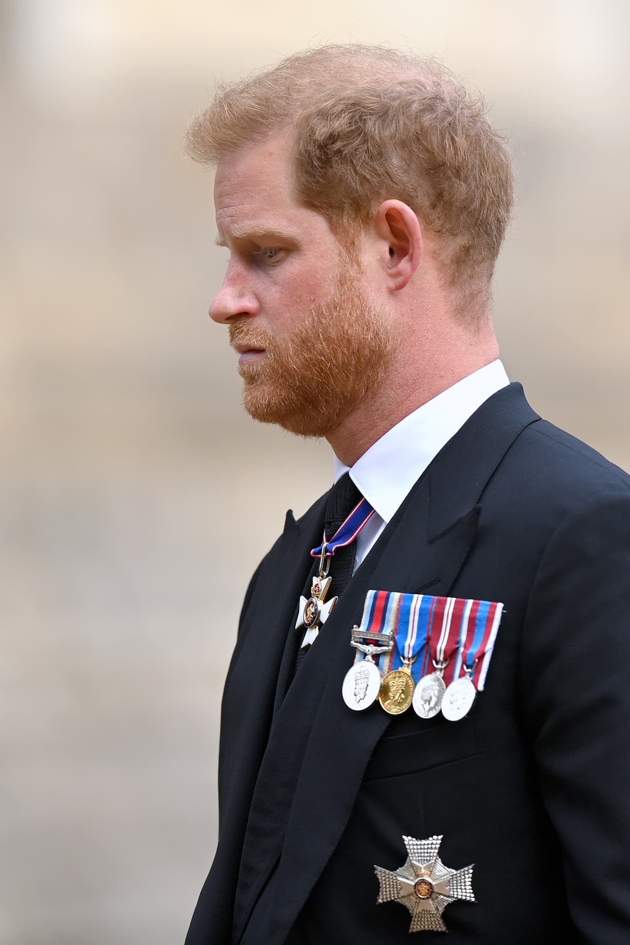 WINDSOR, ENGLAND - SEPTEMBER 19: Prince Harry, Duke of Sussex at St George's Chapel for the Committal Service for Queen Elizabeth II on September 19, 2022 in Windsor, England. The committal service at St George's Chapel, Windsor Castle, took place following the state funeral at Westminster Abbey. A private burial in The King George VI Memorial Chapel followed. Queen Elizabeth II died at Balmoral Castle in Scotland on September 8, 2022, and is succeeded by her eldest son, King Charles III. (Photo by Justin Setterfield/Getty Images)