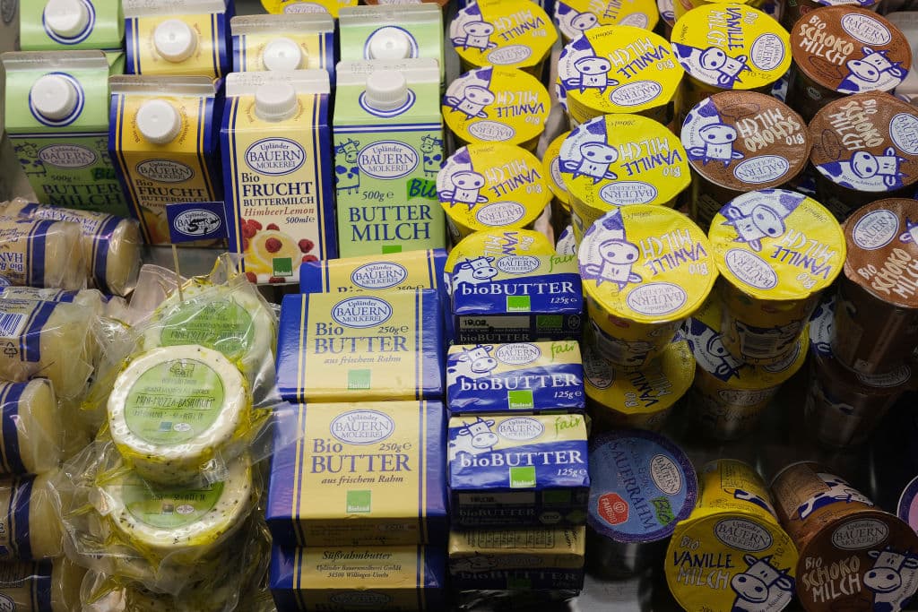 BERLIN, GERMANY - JANUARY 17: Organic milk products, including yoghurt, buttermilk, butter and cheese, lie on display at the Green Week (Grüne Woche) agricultural trade fair on January 17, 2020 in Berlin, Germany. Green Week will be open to the public from January 17-26. (Photo by Sean Gallup/Getty Images)