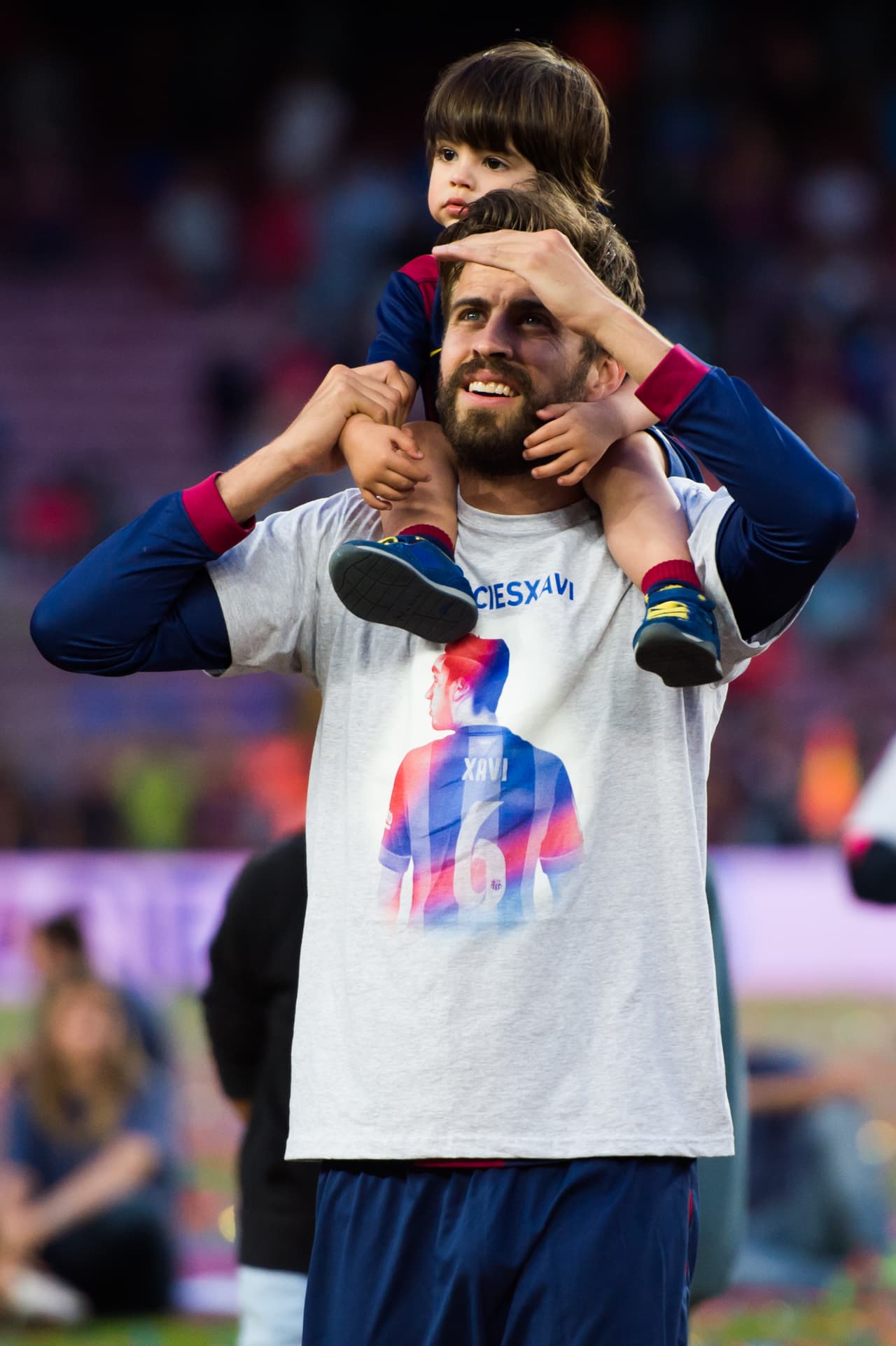 BARCELONA, SPAIN - MAY 23: Gerard Pique of FC Barcelona carries his son Milan Pique after the La Liga match between FC Barcelona and RC Deportivo La Coruna at Camp Nou on May 23, 2015 in Barcelona, Spain. (Photo by Alex Caparros/Getty Images)