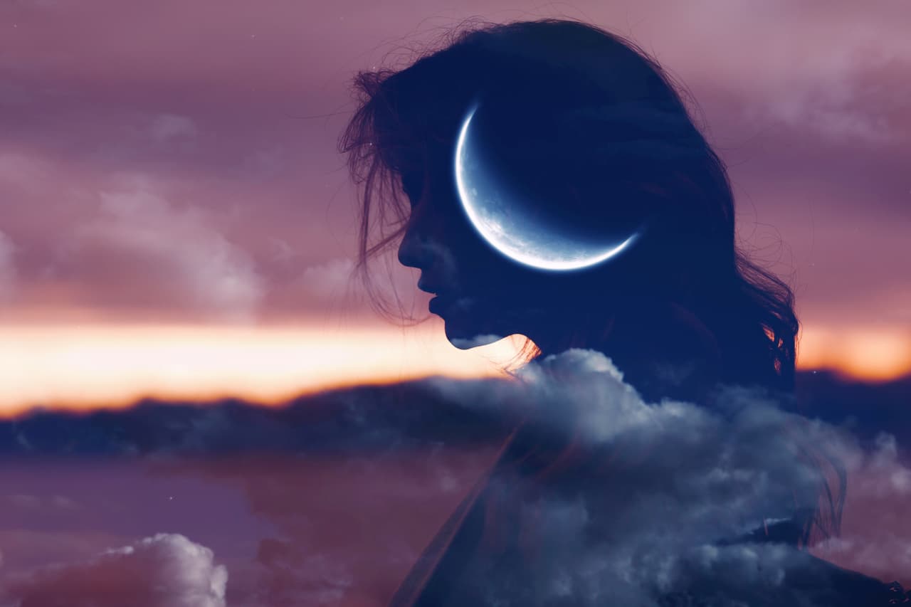 Beautiful woman profile silhouette portrait with moon in her head.