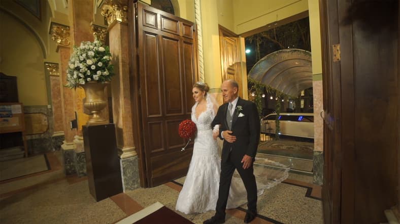 Bride and father of the bride entering in the church