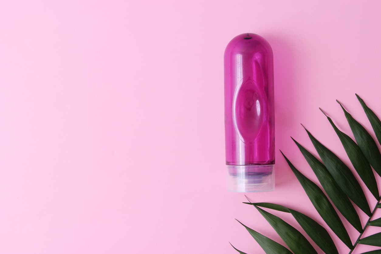 An intimate lubricant for comfortable sex close-up on a colored background. High quality photo