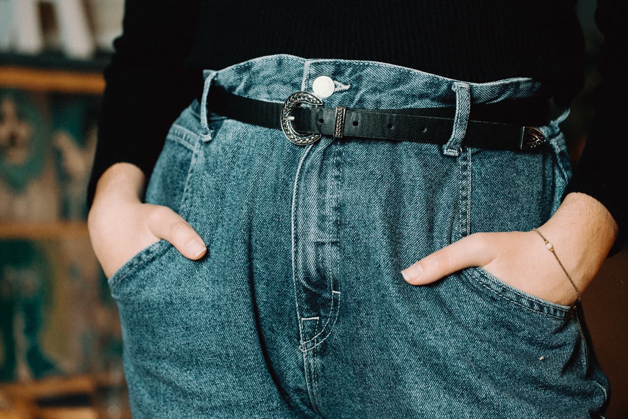 A close up of a woman on mom jeans