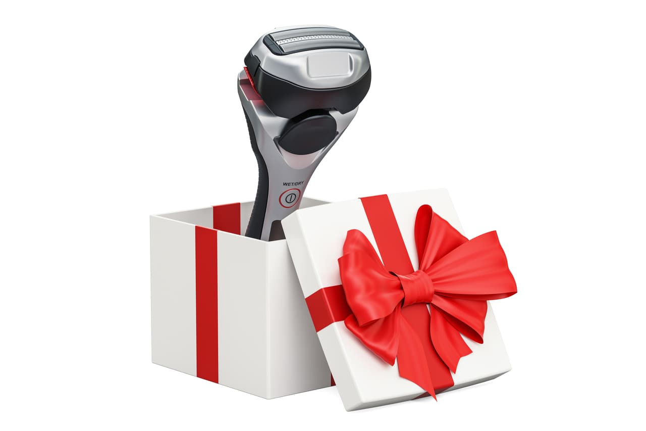Gift concept, electric shaver inside gift box. 3D rendering isolated on white background