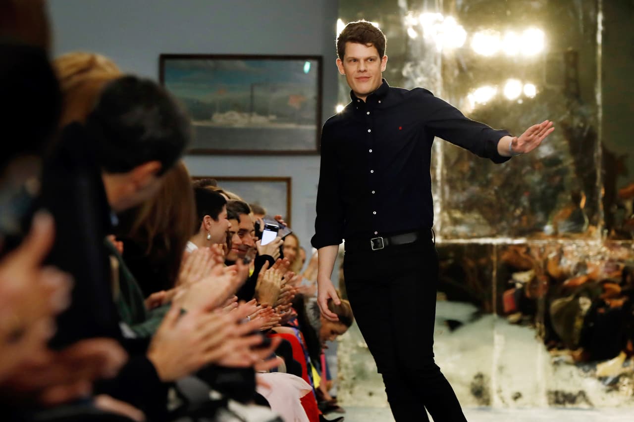 Creative Director Wes Gordon acknowledges audience applause after the Carolina Herrera collection is modeled during Fashion Week in New York, Monday, Feb. 11, 2019. (AP Photo/Richard Drew)