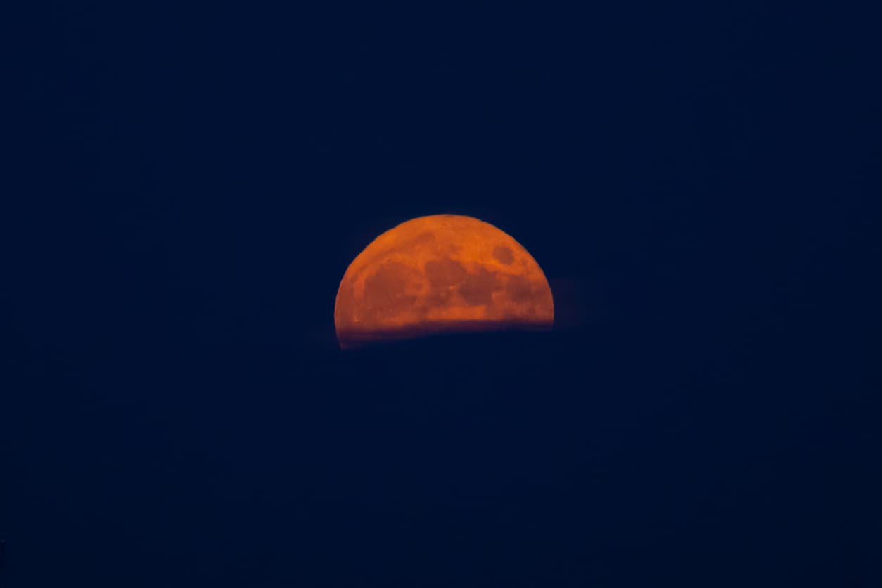 Red moon, over blue sky. full moon