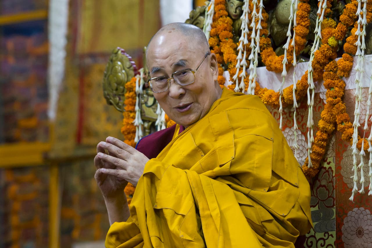 Tibetan spiritual leader the Dalai Lama sits on his ceremonial chair at Tsuglakhang temple in Dharmsala, India, Friday, May 17, 2019. Four oracles went into a trance and spoke to the the Dalai Lama during an event at the Tsuglakhang temple where exile Tibetans gathered to pray for the longevity of their spiritual leader. (AP Photo/Ashwini Bhatia)