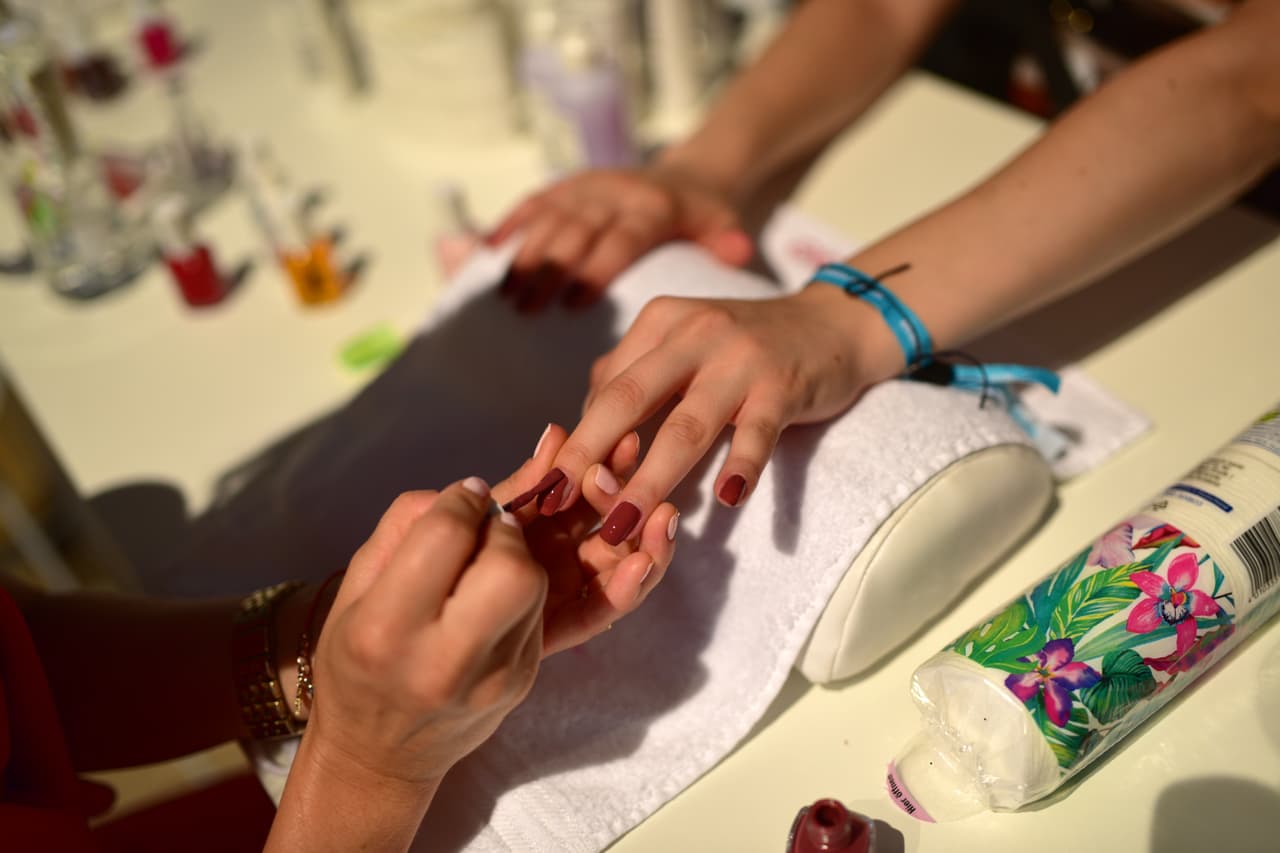 BERLIN, GERMANY - JUNE 30: A general view of guests getting their nails done at the Maybelline New York during the Mercedes-Benz Fashion Week Berlin Spring/Summer 2017 at Erika Hess Eisstadion on June 29, 2016 in Berlin, Germany. (Photo by Thomas Lohnes/Getty Images for IMG)