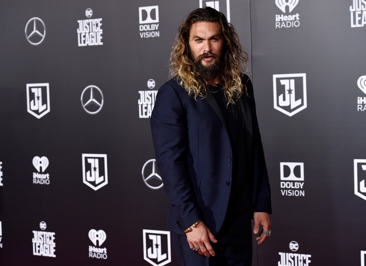 Jason Momoa, a cast member in "Justice League," poses at the premiere of the film at the Dolby Theatre on Monday, Nov. 13, 2017, in Los Angeles. (Photo by Chris Pizzello/Invision/AP)