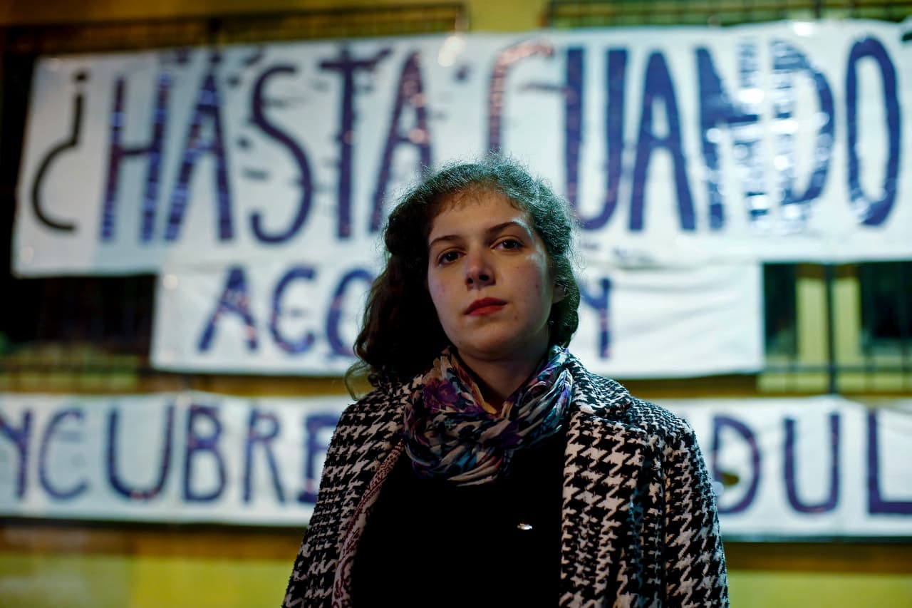 In this May 31, 2018 photo, law student Sofia Brito, poses for a photo, in Santiago, Chile. The 24-year-old law student overcame her fear and filed a sexual harassment complaint with officials at the University of Chile against her professor, Carlos Carmona, one of the country's most prominent legal scholars.(AP Photo/Luis Hidalgo)