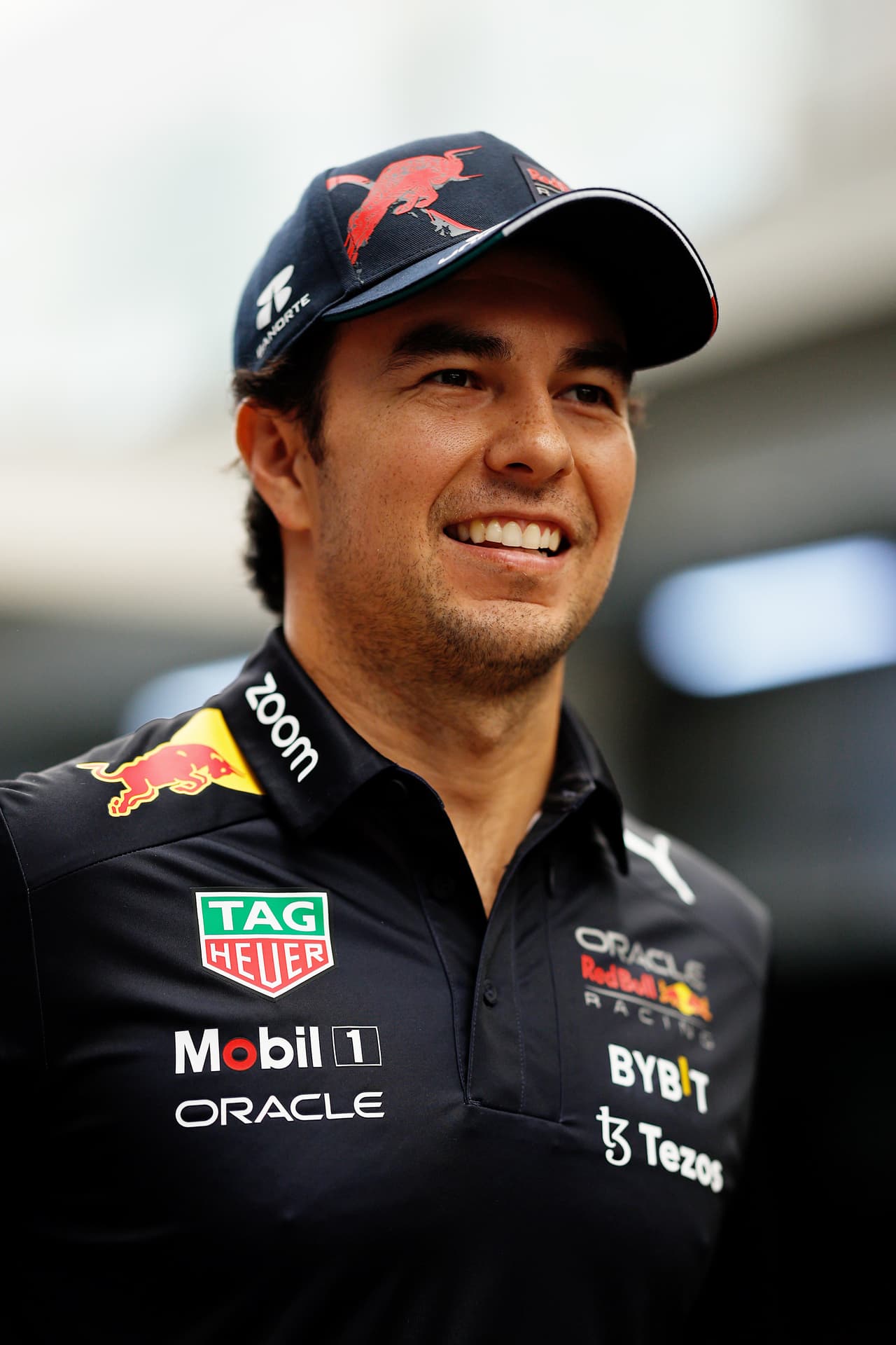 SAO PAULO, BRAZIL - NOVEMBER 11: Sergio Perez of Mexico and Oracle Red Bull Racing walks in the Paddock prior to practice ahead of the F1 Grand Prix of Brazil at Autodromo Jose Carlos Pace on November 11, 2022 in Sao Paulo, Brazil. (Photo by Chris Graythen/Getty Images)