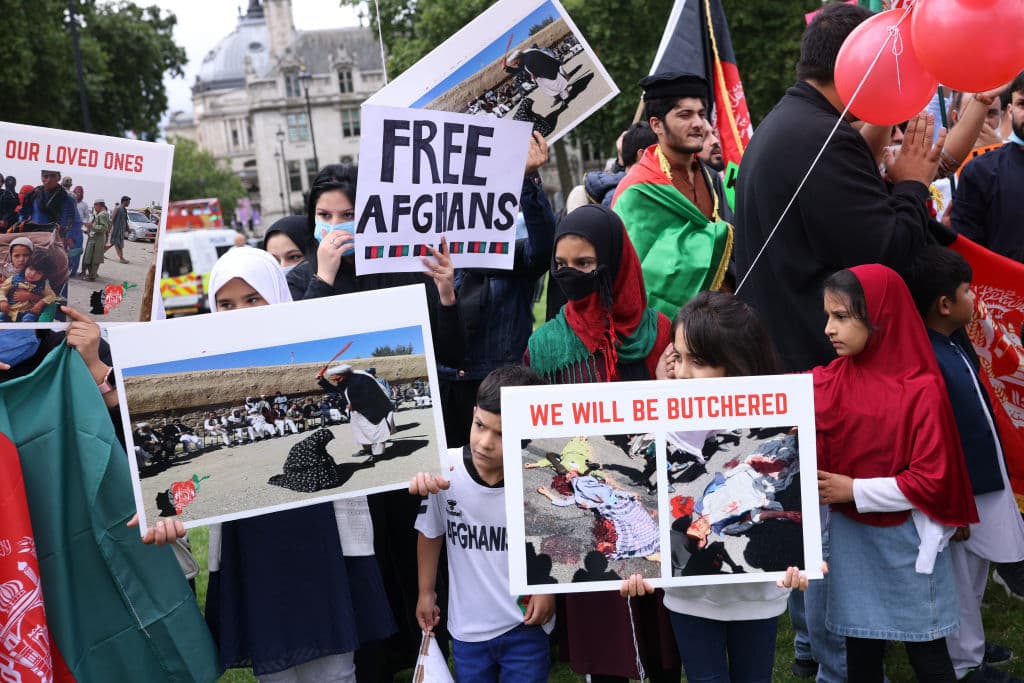 LONDON, UNITED KINGDOM - AUGUST 18: Protesters gather on Parliament Square to protest against the Taliban take over of Afghanistan on August 18, 2021 in London, United Kingdom. House of Commons Speaker, Sir Lindsay Hoyle, recalled parliament from its summer recess to debate the situation in Afghanistan after a request from the government. (Photo by Dan Kitwood/Getty Images)