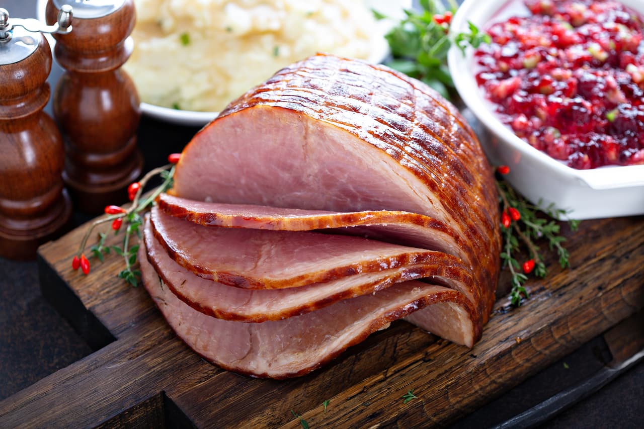 Holiday glazed ham for Christmas dinner with cranberry sauce