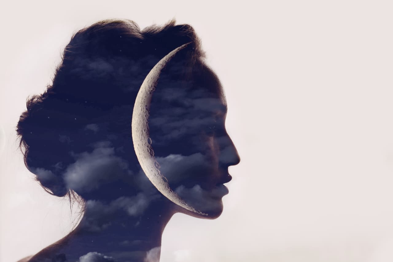 Beautiful woman profile silhouette portrait with moon in her head.