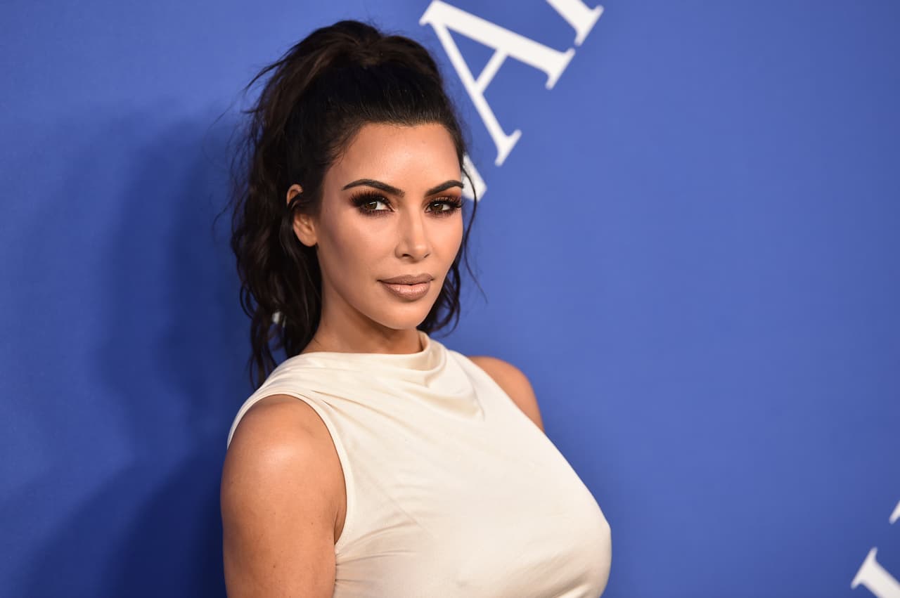 FILE - In this June 4, 2018 file photo, Kim Kardashian West arrives at the CFDA Fashion Awards at the Brooklyn Museum in New York. The reality star successfully appealed to President Donald Trump to release Alice Marie Johnson from prison. Johnson, who spent more than two decades in federal prison on 1996 drug convictions and was not eligible for parole, had her sentence commuted this week. (Photo by Evan Agostini/Invision/AP, File)