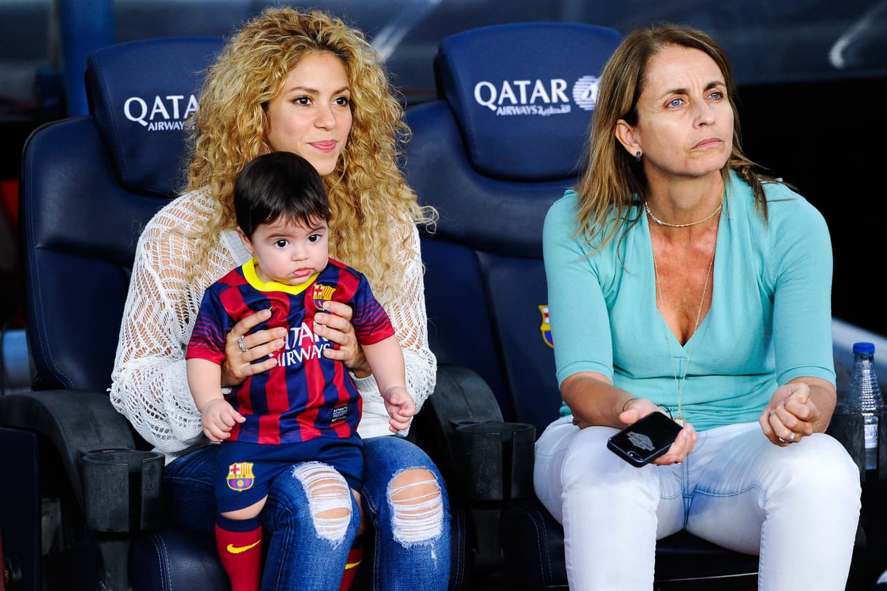 BARCELONA, SPAIN - SEPTEMBER 14: Shakira and Montserrat Bernabeu, Gerard Pique's mother, play with Milan prior to the La Liga match between FC Barcelona and Sevilla FC at Camp Nou on September 14, 2013 in Barcelona, Spain. (Photo by David Ramos/Getty Images)