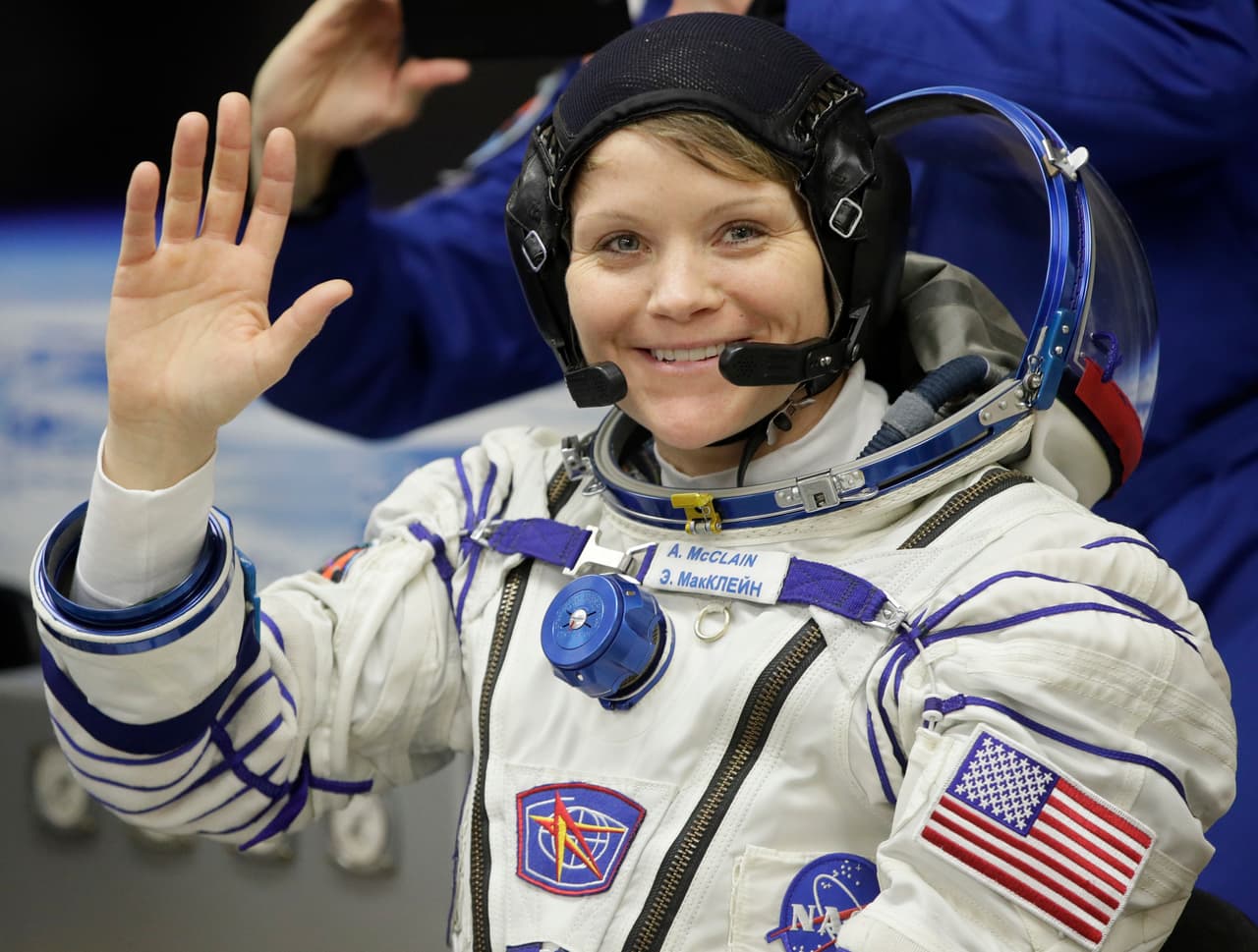 U.S. astronaut Anne McClain, member of the main crew of the expedition to the International Space Station (ISS), gestures prior to the launch of Soyuz MS-11 space ship at the Russian leased Baikonur cosmodrome, Kazakhstan, Monday, Dec. 3, 2018. (AP Photo/Dmitri Lovetsky)