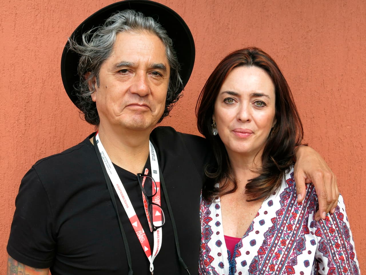 FILE - In this Dec. 5, 2015 file photo, Mexican musician Armando Vega Gil, left, and author Beatriz Rivas pose for a portrait during the Guadalajara International Book Fair in Guadalajara, Mexico. The Mexican rock band Botellita de Jerez announced on Monday, April 1, 2019 the death of its founder Armando Vega Gil. The musician and writer had posted a message announcing his suicide. (AP Photo/Berenice Bautista, File)