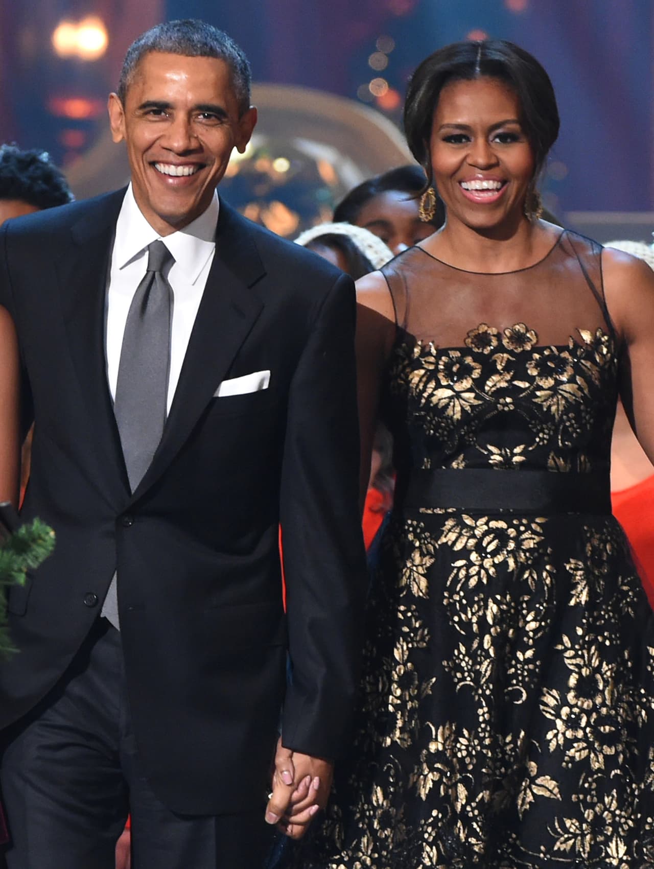 WASHINGTON, DC - DECEMBER 14: U.S. President Barack Obama and First Lady Michelle Obama speak onstage at TNT Christmas in Washington 2014 at the National Building Museum on December 14, 2014 in Washington, DC. 25248_001_0621.JPG (Photo by Theo Wargo/WireImage)