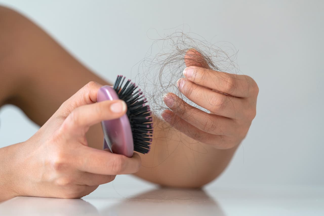 Losing hair? Hair brush, complete with hair.