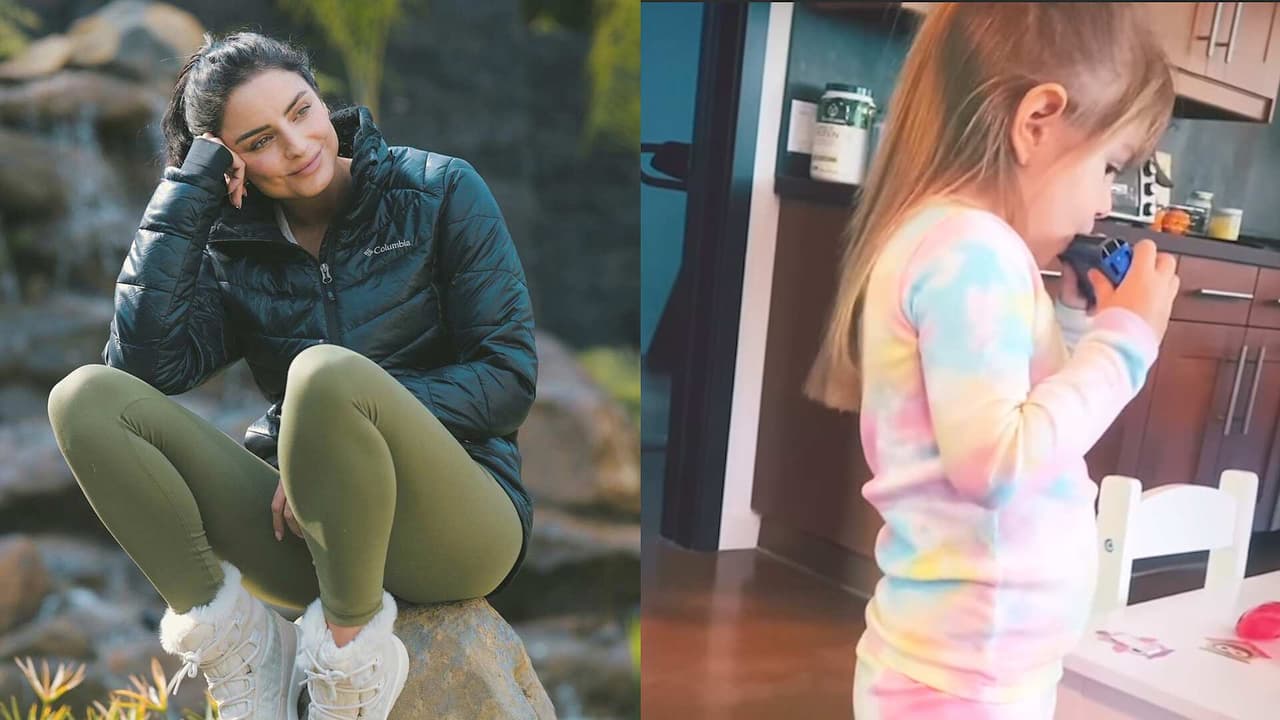 Kailani Ochmann toca una melodía en la armónica para su mamá