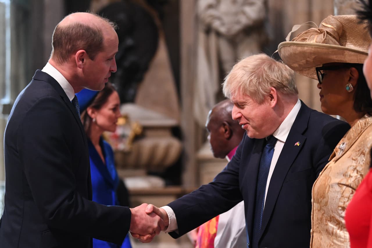 LONDON, ENGLAND - MARCH 14: Britain's Prince William, Duke of Cambridge, (L) shakes hands with Britain's Prime Minister Boris Johnson (R) upon arrival at Westminster Abbey to attend the Commonwealth Day service ceremony on March 14, 2022 in London, England. (Photo by Daniel Leal-WPA Pool/Getty Images)