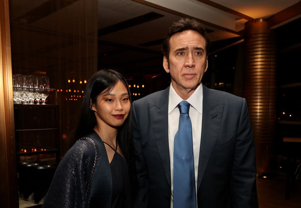 WEST LOS ANGELES, CALIFORNIA - JULY 13: Nicolas Cage (R) and Riko Shibata pose at the after party for the premiere of Neon's "Pig" at Craft Restaurant on July 13, 2021 in West Los Angeles, California. (Photo by Kevin Winter/Getty Images)