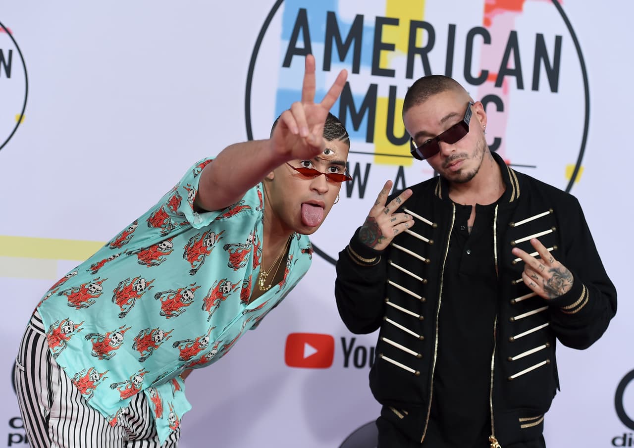 Bad Bunny, left, and J Balvin arrive at the American Music Awards on Tuesday, Oct. 9, 2018, at the Microsoft Theater in Los Angeles. (Photo by Jordan Strauss/Invision/AP)