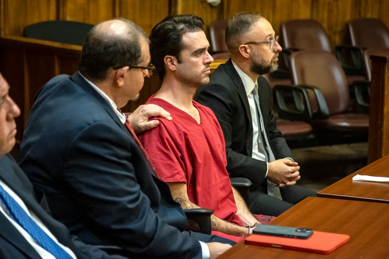 Miami, FL- February 3, 2023 - Attorney Phillip Reizenstein places his hand on Pablo Lyles shoulder as the sentence is read by Judge Marisa Tinkler Mendez. Pablo Lyle killed 63-year-old Juan Ricardo Hernandez during a road rage incident in 2019 and was convicted of manslaughter last October 2022.